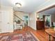 Classic foyer with hardwood floors, elegant staircase, and traditional decor, leading to various rooms at 4951 Dayspring Dr, Mint Hill, NC 28227
