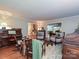 Spacious living room featuring hardwood floors, classic furnishings, and views into other parts of the home at 4951 Dayspring Dr, Mint Hill, NC 28227
