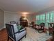 Comfortable living room with vintage furniture, classic shutters, and a cozy, inviting atmosphere at 4951 Dayspring Dr, Mint Hill, NC 28227