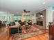 Inviting living room with brick fireplace, plush seating, natural light, and hardwood floors at 4951 Dayspring Dr, Mint Hill, NC 28227