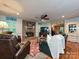 Comfortable living room with brick fireplace, hardwood floors, and open layout with natural light at 4951 Dayspring Dr, Mint Hill, NC 28227