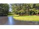 Scenic view of the backyard pond and lush trees at 5183 Mill Race Ln, Lancaster, SC 29720