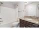 Cozy bathroom features a tub shower, granite countertop vanity, decorative mirror, and chrome hardware at 5183 Mill Race Ln, Lancaster, SC 29720