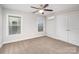 Bedroom with a ceiling fan, windows, and base trim that is ready to be furnished and lived in at 5183 Mill Race Ln, Lancaster, SC 29720