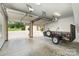 Spacious garage with multiple bay doors, a trailer, and lots of space for cars and storage at 5183 Mill Race Ln, Lancaster, SC 29720
