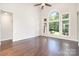 A sunlit living room with large windows and hardwood floors at 5183 Mill Race Ln, Lancaster, SC 29720