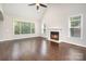 Open living room with a fireplace and hardwood floors at 5183 Mill Race Ln, Lancaster, SC 29720