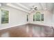 Bright, spacious main bedroom featuring a ceiling fan, large windows, and hardwood floors at 5183 Mill Race Ln, Lancaster, SC 29720