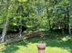 A view of trees and yard space with a decorative garden urn at 5495 Valley Run St, Hickory, NC 28601