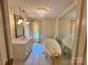 A stylish bathroom featuring a vintage-style tub, a large mirror, and yellow floral wallpaper at 5495 Valley Run St, Hickory, NC 28601