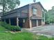 Brick house featuring a two-car garage and an upper-level deck at 5495 Valley Run St, Hickory, NC 28601