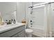 Bathroom with grey vanity, quartz countertop, and tub shower combo at 5723 Notch Peak Ave, Indian Land, SC 29707