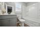 Bathroom featuring a shower/tub combination, a toilet, vanity and sink with white countertops and gray cabinetry at 5723 Notch Peak Ave, Indian Land, SC 29707