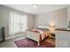 Comfortable bedroom with hardwood floors and ample natural light at 5723 Notch Peak Ave, Indian Land, SC 29707