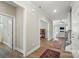 Neutral-toned hallway with hardwood floors and views into other rooms at 5723 Notch Peak Ave, Indian Land, SC 29707
