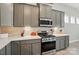 Modern kitchen with stainless steel appliances, sleek countertops, and ample cabinet space at 5723 Notch Peak Ave, Indian Land, SC 29707
