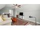 Comfortable living room with hardwood floors, comfortable furniture, and ample lighting at 5723 Notch Peak Ave, Indian Land, SC 29707
