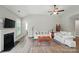 Cozy living room showcasing a fireplace, comfortable seating, and stylish decor at 5723 Notch Peak Ave, Indian Land, SC 29707