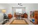 Inviting home office featuring hardwood floors, a ceiling fan, and warm lighting at 5723 Notch Peak Ave, Indian Land, SC 29707