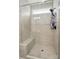Modern tiled shower featuring a built-in bench and sleek glass enclosure at 5723 Notch Peak Ave, Indian Land, SC 29707