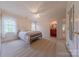 Cozy bedroom with carpet flooring, floral bedding, natural light, and adjoining bathroom at 6024 Highview Rd, Weddington, NC 28104