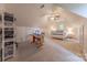 Cozy bedroom features vaulted ceilings, ceiling fan, and sewing/craft area, and neutral carpet at 6024 Highview Rd, Weddington, NC 28104