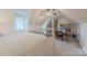 Cozy bedroom features vaulted ceilings, ceiling fan, and sewing/craft area, and neutral carpet at 6024 Highview Rd, Weddington, NC 28104