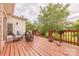 Relaxing outdoor deck area featuring wood floors, natural views, and comfortable seating with outdoor furniture at 6024 Highview Rd, Weddington, NC 28104