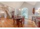 Formal dining room with hardwood floors adjacent to entry foyer and staircase at 6024 Highview Rd, Weddington, NC 28104