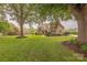 Charming brick home boasts a sprawling lawn, mature trees, and classic architectural details at 6024 Highview Rd, Weddington, NC 28104