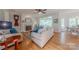 Open-concept living space with hardwood floors, fireplace, and neutral décor offers a seamless flow at 6024 Highview Rd, Weddington, NC 28104