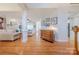 Open-concept living space with hardwood floors, fireplace, and elegant furnishings creates a cozy ambiance at 6024 Highview Rd, Weddington, NC 28104