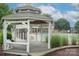 Community gazebo offering a relaxing view of the pool and waterfall feature at 6310 Highland Commons Rd, Charlotte, NC 28269