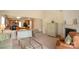 Open-concept living room with fireplace, hardwood floors, and seamless flow to the kitchen at 6310 Highland Commons Rd, Charlotte, NC 28269