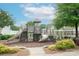 Community playground with slides, climbing structures, and seating area, perfect for Gathering fun at 6310 Highland Commons Rd, Charlotte, NC 28269