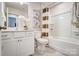 Bright bathroom with white cabinetry, a shower-tub combination, and modern fixtures, designed for everyday convenience at 7108 Hodges Meadow Ln, Charlotte, NC 28213