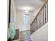 Welcoming entryway features hardwood floors, a staircase, and natural light, creating a warm first impression at 7108 Hodges Meadow Ln, Charlotte, NC 28213
