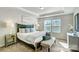 Serene main bedroom boasts tray ceilings, plush carpeting, and bright windows, offering a peaceful retreat at 7108 Hodges Meadow Ln, Charlotte, NC 28213
