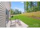 Inviting patio space with chairs and table, perfect for outdoor relaxation in the well-kept backyard at 7205 Finnigan Rd, Charlotte, NC 28215