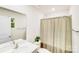 Well-lit bathroom featuring a vanity with a single sink, toilet, and shower with curtain at 7205 Finnigan Rd, Charlotte, NC 28215