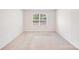 Spacious bedroom featuring carpet flooring and a bright window at 7205 Finnigan Rd, Charlotte, NC 28215