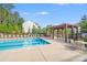 Community pool features a pergola-covered lounge area for residents to relax at 7205 Finnigan Rd, Charlotte, NC 28215