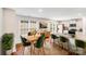 Bright and airy dining room connecting to an open kitchen with stainless steel appliances at 7205 Finnigan Rd, Charlotte, NC 28215