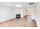 Bright living room featuring a classic fireplace and hardwood floors at 7205 Finnigan Rd, Charlotte, NC 28215