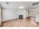 Bright living room featuring a classic fireplace and hardwood floors at 7205 Finnigan Rd, Charlotte, NC 28215
