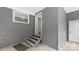 Covered back porch featuring wooden steps and an exterior door with access to the backyard at 7860 Henry Harris Rd, Fort Mill, SC 29707