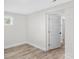 Empty, neutral room showing a brick wall, window, and an open doorway at 7860 Henry Harris Rd, Fort Mill, SC 29707