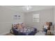 Comfortable bedroom with decorative accents and floral bedding at 7860 Henry Harris Rd, Fort Mill, SC 29707