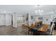 Open dining area and living spaces with hardwood flooring, seamlessly connecting with recessed shelving at 7860 Henry Harris Rd, Fort Mill, SC 29707