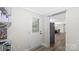 Inviting entryway with wood flooring and access to dining area with view of the large refrigerator at 7860 Henry Harris Rd, Fort Mill, SC 29707